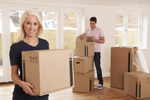 Removals van transporting furniture through a residential area in Freezywater
