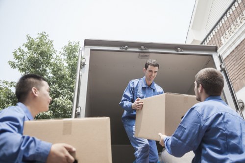 Removal team planning a house move in a Freezywater residential street