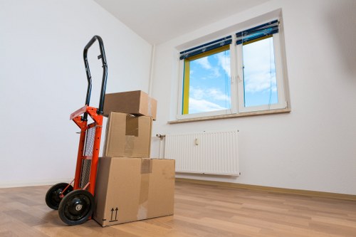 Staff using PPE while handling furniture during a Freezywater move