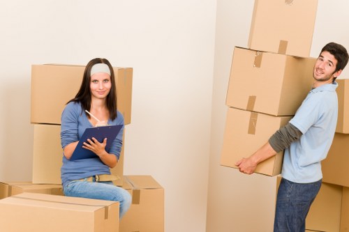 Local movers handling furniture in a Freezywater street