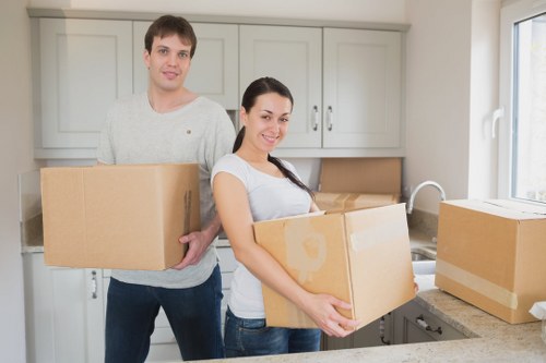 Unpacking service helping a family settle into a Freezywater property